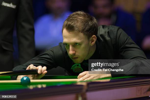 Judd Trump of England plays a shot during the semifinal match against Kyren Wilson of England on day seven of The Dafabet Masters at Alexandra Palace...