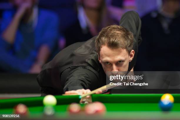 Judd Trump of England plays a shot during the semifinal match against Kyren Wilson of England on day seven of The Dafabet Masters at Alexandra Palace...