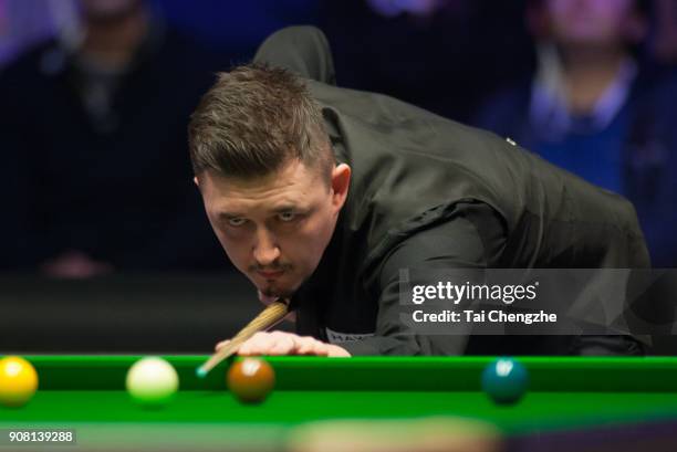 Kyren Wilson of England plays a shot during the semifinal match against Judd Trump of England on day seven of The Dafabet Masters at Alexandra Palace...