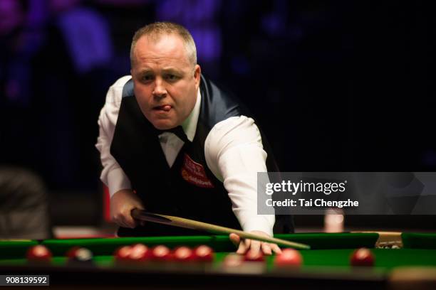 John Higgins of Scotland reacts during the semifinal match against Mark Allen of Northern Ireland on day seven of The Dafabet Masters at Alexandra...