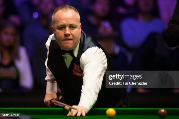 John Higgins of Scotland reacts during the semifinal match against Mark Allen of Northern Ireland on day seven of The Dafabet Masters at Alexandra...