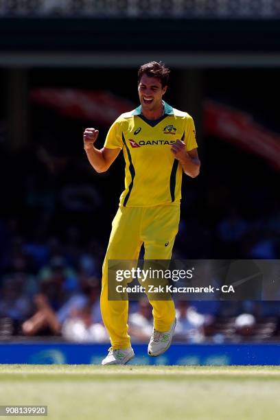 Pat Cummins of Australia celebrates after dismissing Jason Roy of England during game three of the One Day International series between Australia and...