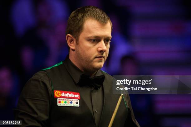 Mark Allen of Northern Ireland reacts during the semifinal match against John Higgins of Scotland on day seven of The Dafabet Masters at Alexandra...