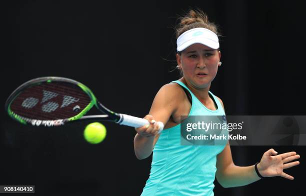 Kamilla Rakhimova of Russia plays a backhand against Ali Collins of Great Britain during the Australian Open 2018 Junior Championships at Melbourne...