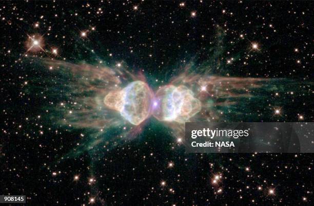 Hubble Space Telescope image released February 1, 2001 of the so-called "ant nebula" reveals the "ant's" body as a pair of fiery lobes protruding...