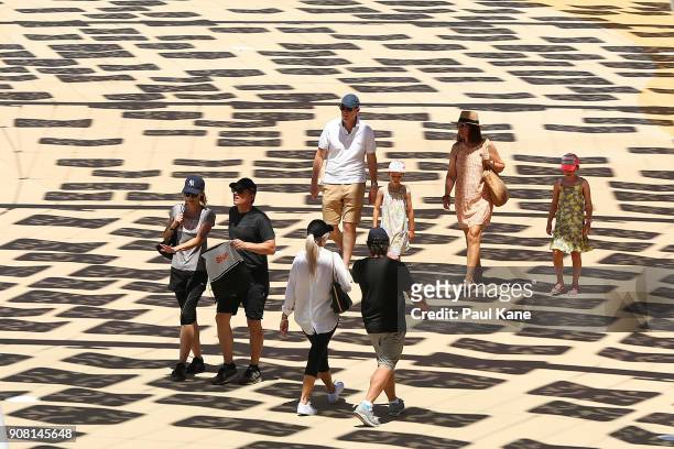 Members of the public walk along a pathway at Optus Stadium on January 21, 2018 in Perth, Australia. The 60,000 seat multi-purpose Stadium features...