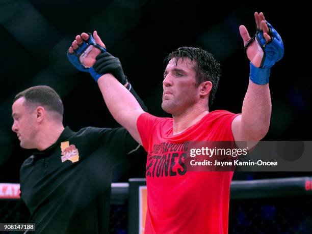 Referee Mike Beltran raises the arm of Chael Sonnen as he defeated Quinton Jackson in their Heavyweight World Title fight at Bellator 192 at The...