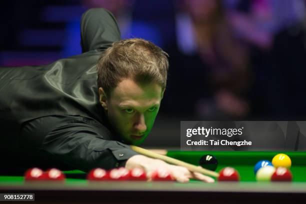 Judd Trump of England plays a shot during the semifinal match against Kyren Wilson of England on day seven of The Dafabet Masters at Alexandra Palace...