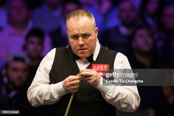 John Higgins of Scotland reacts during the semifinal match against Mark Allen of Northern Ireland on day seven of The Dafabet Masters at Alexandra...
