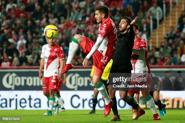 Ventura Alvarado of Necaxa and Rodolfo Pizarro of Chivas compete for the ball during the third round match between Necaxa and Chivas as part of...