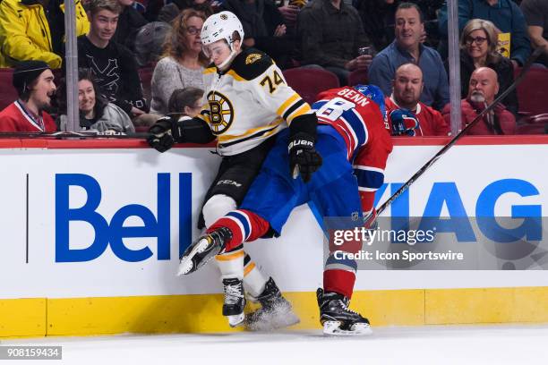 Montreal Canadiens defenseman Jordie Benn collides with Boston Bruins left wing Jake DeBrusk during the first period of the NHL game between the...