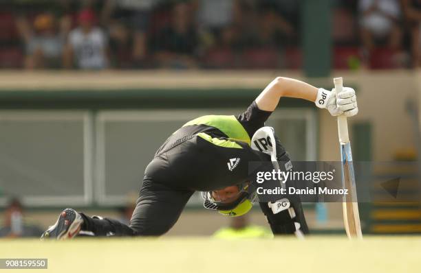 Thunder Nicola Carey loses her balance during the Women's Big Bash League match between the Adelaide Strikers and the Sydney Thunder at Robertson...