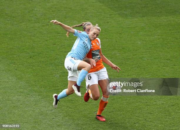 Jess Fishlock of Melbourne City gets the ball ahead of Celeste Boureille of the Roar during the round 12 W-League match between Melbourne City and...