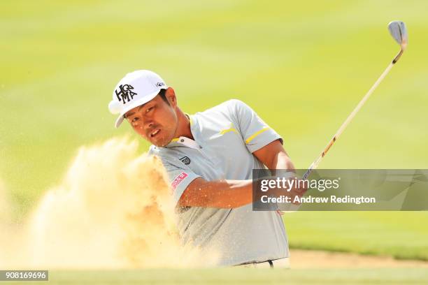 Hideto Tanihara of Japan plays his third shot from a bunker on the 17th hole during the final round of the Abu Dhabi HSBC Golf Championship at Abu...