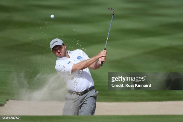 Richard Sterne of South Africa plays his third shot from a bunker on the second hole during the final round of the Abu Dhabi HSBC Golf Championship...