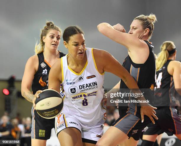 Liz Cabbage of the Boomers drives to the basket past Suzy Batkovic of the Fire during game three of the WNBL Grand Final series between the...