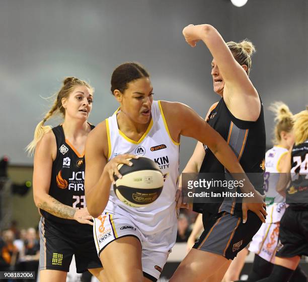 Liz Cabbage of the Boomers drives to the basket past Suzy Batkovic of the Fire during game three of the WNBL Grand Final series between the...