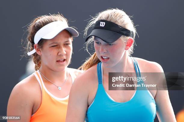 Elysia Bolton of the United States and Nicole Mossmer of the United States talk tactics in their doubles match against Alexa Noel of the United...