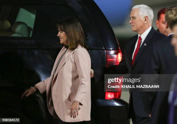 Vice President Mike Pence and his wife Karen Pence get into their car upon their arrival in the Jordanian capital Amman, late on January 20, 2018. /...