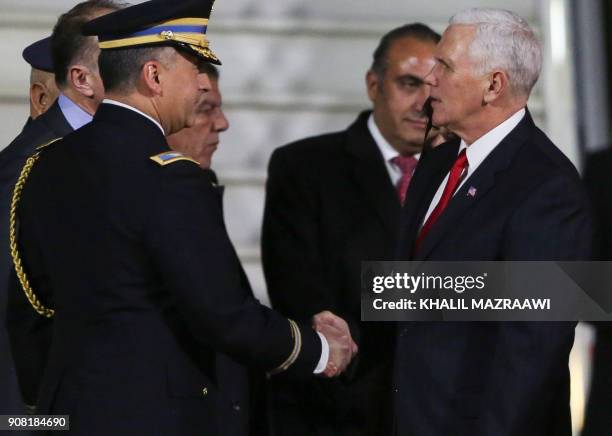 Vice President Mike Pence shakes hands with Jordanian officials upon his arrival in the capital Amman, late on January 20, 2018. / AFP PHOTO / Khalil...