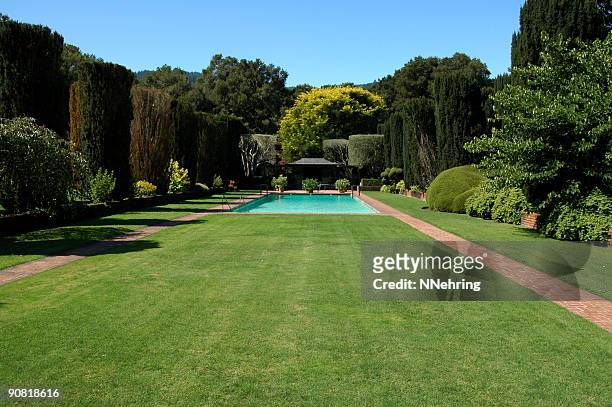 swimming pool in formal garden - yard grounds stock pictures, royalty-free photos & images