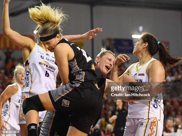 Sydney Wiese of the Fire collides with Suzy Batkovic of the Fire during game three of the WNBL Grand Final series between the Townsville Fire and...