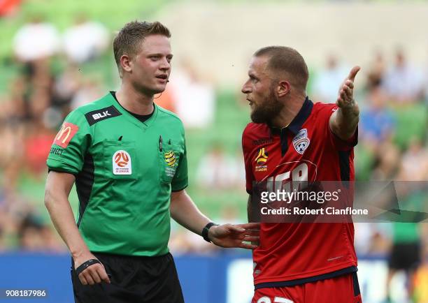 Referee Adam Fielding speaks to Daniel Adlung of United during the round 17 A-League match between Melbourne City and Adelaide united at AAMI Park on...