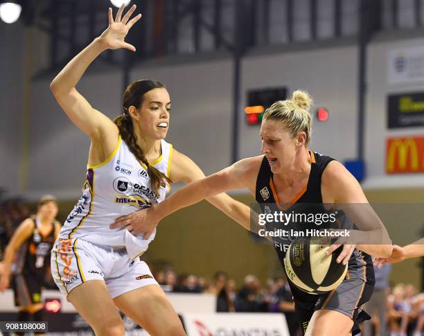 Suzy Batkovic of the Fire drives to the basket past Louella Tomlinson of the Boomers during game three of the WNBL Grand Final series between the...