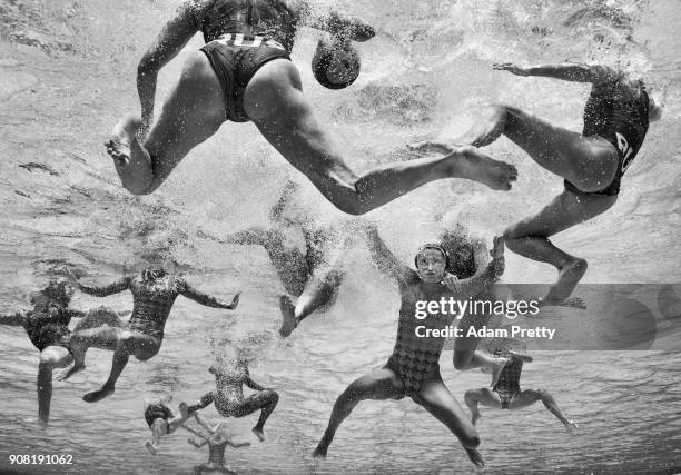 Zamira Myrabekova of Kazakstan is held underwater by the strong Russian defence during the Women's Water Polo Group D preliminary round match between...