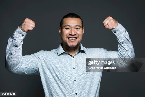 exited man - flexing muscles stock pictures, royalty-free photos & images