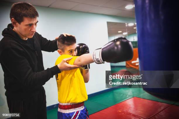 practicing in the boxing hall - boxing coach stock pictures, royalty-free photos & images
