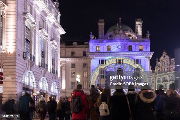 Light painting projected onto external walls of buildings around Piccadilly Circus during Lumiere London 2018.