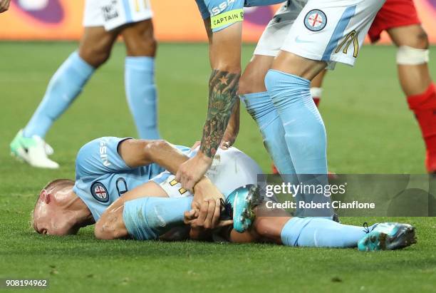 Nathaniel Atkinson of the City is stretchered off with an injury during the round 17 A-League match between Melbourne City and Adelaide United at...