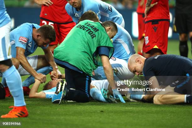 Nathaniel Atkinson of the City is stretchered off with an injury during the round 17 A-League match between Melbourne City and Adelaide United at...