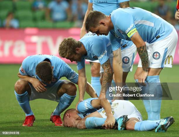 Nathaniel Atkinson of the City is stretchered off with an injury during the round 17 A-League match between Melbourne City and Adelaide United at...