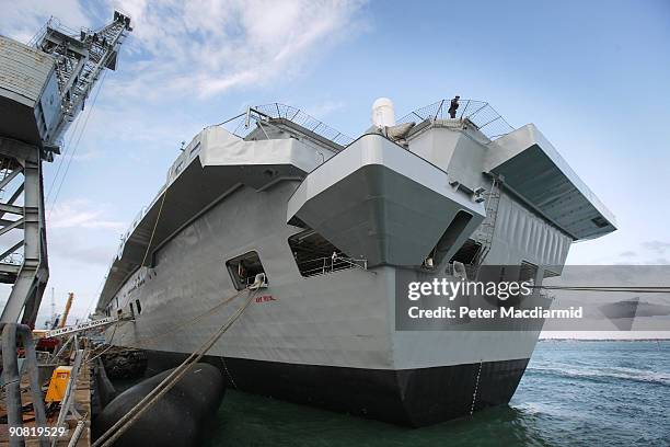 Rating on guard duty looks over the stern of HMS Royal on September 15, 2009 in Portsmouth, England. The Royal Navy's flag ship HMS Ark Royal, which...