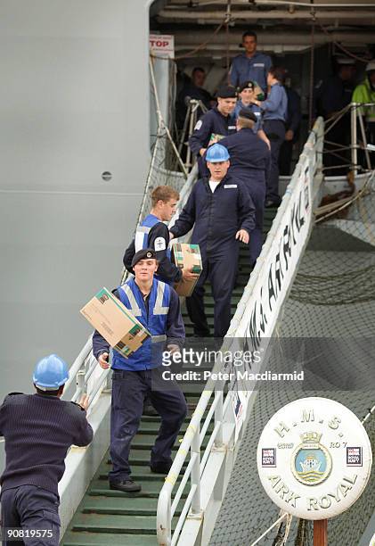 Ark Royal crew transfer food and supplies onboard on September 15, 2009 in Portsmouth, England. The Royal Navy's flag ship HMS Ark Royal, which first...