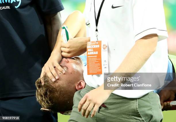 Nathaniel Atkinson of the City is stretchered off with an injury during the round 17 A-League match between Melbourne City and Adelaide United at...