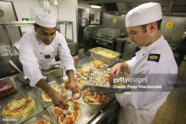 The ships crew prepare food onboard HMS Ark Royal on September 15, 2009 in Portsmouth, England. The Royal Navy's flag ship HMS Ark Royal, which first...