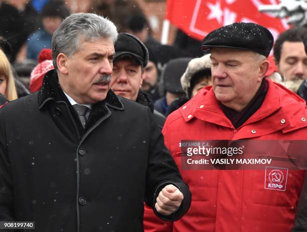 Russian Communist Party leader Gennady Zuganov speaks with presidential candidate Pavel Grudinin as they take part in a memorial ceremony to mark the...