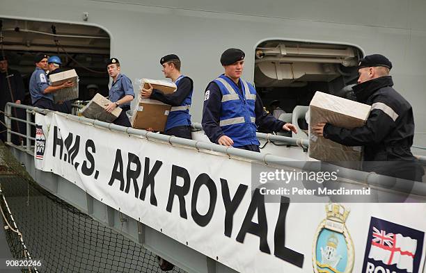 Ark Royal crew transfer food and supplies onboard on September 15, 2009 in Portsmouth, England. The Royal Navy's flag ship HMS Ark Royal, which first...