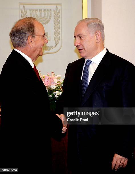 Israel's Prime Minister Benjamin Netanyahu shakes hands with U.S. Middle East envoy George Mitchell before their meeting September 16, 2009 in...