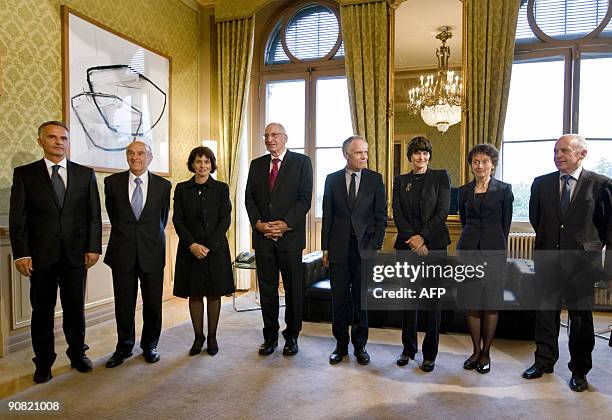 New Federal Councillor Didier Burkhalter poses with his colleague Swiss president Hans-Rudolf Merz, Doris Leuthard, Pascal Couchepin, Moritz...