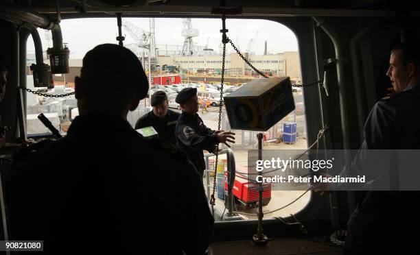 Ark Royal crew transfer food and supplies onboard on September 15, 2009 in Portsmouth, England. The Royal Navy's flag ship HMS Ark Royal, which first...