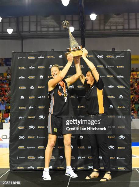 Suzy Batkovic of the Fire and MVP and Fire coach Claudia Brassard lift the WNBL Championship trophy after winning game three of the WNBL Grand Final...