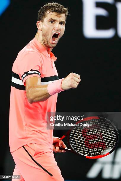 Grigor Dimitrov of Bulgaria celebrates winning the second set in his fourth round match against Nick Kyrgios of Australia on day seven of the 2018...