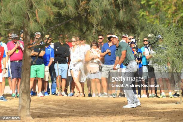 Ross Fisher of England plays his third shot on the tenth hole during the final round of the Abu Dhabi HSBC Golf Championship at Abu Dhabi Golf Club...