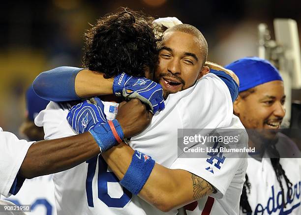 Andre Ethier and teammate Matt Kemp of the Los Angeles Dodgers celebrate after defeating the Pittsburgh Pirates 5-4 in 13 innings at Dodger Stadium...