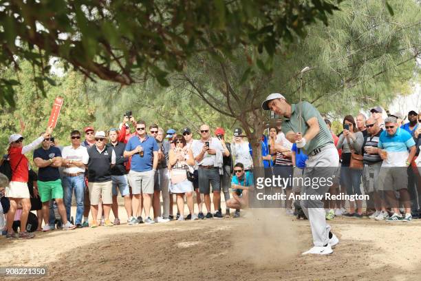 Ross Fisher of England prepares to play his third shot on the tenth hole during the final round of the Abu Dhabi HSBC Golf Championship at Abu Dhabi...