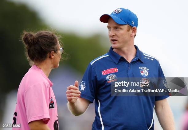 Paul Groves, Senior Coach of the Bulldogs chats to Emma Kearney of the Bulldogs during the 2018 AFLW Practice match between the Western Bulldogs and...